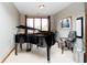 Cozy piano room featuring a grand piano and bright natural light at 4052 Diamond Row, Greenwood, IN 46143