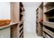 Custom walk-in closet with wood shelves and storage drawers at 4052 Diamond Row, Greenwood, IN 46143