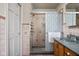 Comfortable bathroom featuring shower, vanity, cabinet, and heated towel rack at 426 Oakwood Dr, Indianapolis, IN 46260