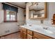 Bright bathroom with a dual sink vanity, ample lighting, and a window, providing a refreshing space at 426 Oakwood Dr, Indianapolis, IN 46260