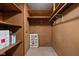 Spacious storage closet with wooden shelving and pegboard walls to keep your belongings well organized at 426 Oakwood Dr, Indianapolis, IN 46260