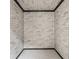 Minimalist room features exposed brick and simple design, offering a blank canvas with potential for customization at 426 Oakwood Dr, Indianapolis, IN 46260