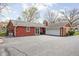 Rear exterior view highlighting the property's garage and patio area at 426 Oakwood Dr, Indianapolis, IN 46260