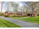 Beautiful home exterior with brick accents and lush landscaping in a large front yard at 426 Oakwood Dr, Indianapolis, IN 46260