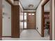 Interior hallway featuring neutral carpet and trim and a view into a dining room at 426 Oakwood Dr, Indianapolis, IN 46260