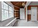 Cozy sunroom with bright windows, built-in bench seating, and ample storage space at 426 Oakwood Dr, Indianapolis, IN 46260