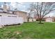 A spacious backyard with a well-maintained lawn and stone siding, great for outdoor activities at 43 Dominion Dr, Zionsville, IN 46077