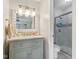 Well-lit bathroom features a modern vanity, a granite countertop, and a glass-enclosed shower at 43 Dominion Dr, Zionsville, IN 46077