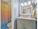 Charming bathroom featuring a vanity with a marble countertop, and an adjacent toilet and shower at 43 Dominion Dr, Zionsville, IN 46077