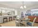 Open concept kitchen and dining area with white countertops and modern appliances at 43 Dominion Dr, Zionsville, IN 46077