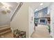 Inviting entryway with staircase, stone fireplace, and modern flooring at 43 Dominion Dr, Zionsville, IN 46077