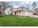 Charming two-story home featuring stone accents, attached garages, and a lush green lawn at 43 Dominion Dr, Zionsville, IN 46077