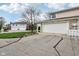 View of the garages and driveways of this well-maintained residence in a neighborhood setting at 43 Dominion Dr, Zionsville, IN 46077