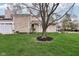 Charming home with a well-kept lawn, stone siding, and a welcoming front entrance at 43 Dominion Dr, Zionsville, IN 46077