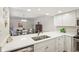 The bright kitchen showcases a modern design with a sink overlooking the dining area at 43 Dominion Dr, Zionsville, IN 46077