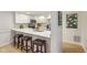 This kitchen features bar seating, stainless steel appliances, and ample countertop space at 43 Dominion Dr, Zionsville, IN 46077
