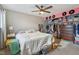 A bedroom with a ceiling fan, closet, and large windows offering plenty of natural light at 43 Dominion Dr, Zionsville, IN 46077