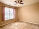 Bright bedroom with large window, plush carpet, and ample natural light at 4327 Switchgrass Way, Indianapolis, IN 46237