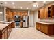 Spacious kitchen featuring stainless steel appliances, ample counter space, and plentiful wood cabinetry at 4327 Switchgrass Way, Indianapolis, IN 46237