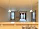 Open-concept kitchen with stainless appliances, plentiful cabinets, and views into the living area, great for gatherings at 4327 Switchgrass Way, Indianapolis, IN 46237