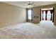 Bright living room with plush carpeting, neutral walls, and open layout, perfect for entertaining guests at 4327 Switchgrass Way, Indianapolis, IN 46237