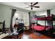 Cozy bedroom featuring a bunk bed, desk, and hardwood floors, perfect for a room at 433 Eastern Ave, Indianapolis, IN 46201