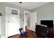 This bedroom features a mini basketball hoop attached to a closet door and hardwood floors at 433 Eastern Ave, Indianapolis, IN 46201