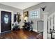 Welcoming foyer featuring hardwood floors, coat rack and natural light at 433 Eastern Ave, Indianapolis, IN 46201