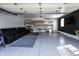 Epoxy floor garage with entertaining space and storage for cars and recreational equipment at 4421 Greenmeadow Ct, Indianapolis, IN 46235