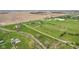 Expansive aerial view of a property featuring well-maintained landscaping and several structures at 4634 E 1000 N, Pittsboro, IN 46167