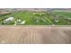 Wide aerial view showcasing a home on a spacious lot amidst rural farmland at 4634 E 1000 N, Pittsboro, IN 46167