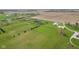Scenic aerial view of homes with large lawn and agricultural land at 4634 E 1000 N, Pittsboro, IN 46167