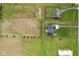 Top-down view of two homes with adjacent farm fields and wooded perimeter at 4634 E 1000 N, Pittsboro, IN 46167