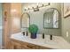 This bathroom features a double vanity, modern fixtures, and a neutral color palette at 4634 E 1000 N, Pittsboro, IN 46167