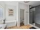 Modern bathroom features a soaking tub, separate shower, and elegant finishes at 4634 E 1000 N, Pittsboro, IN 46167