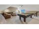 Spacious bonus room with comfortable seating, a ceiling fan, and room for entertaining at 4634 E 1000 N, Pittsboro, IN 46167