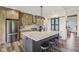 Beautiful kitchen with stainless steel appliances, central island, and custom cabinets at 4634 E 1000 N, Pittsboro, IN 46167