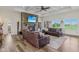Inviting living room features a stone fireplace, coffered ceilings, and large windows overlooking the yard at 4634 E 1000 N, Pittsboro, IN 46167