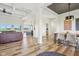 Bright, open-concept living and dining area with hardwood floors and modern finishes; great natural light at 4634 E 1000 N, Pittsboro, IN 46167