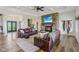 Comfortable living room with a stone fireplace, beamed ceiling, and inviting leather sofas at 4634 E 1000 N, Pittsboro, IN 46167