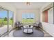 Bright sitting area with views, comfortable chairs, and access to outdoor space at 4634 E 1000 N, Pittsboro, IN 46167