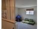 Bright bonus room with a comfy modular sofa and a fun blue play tent at 4810 Oak Hl Dr, Lebanon, IN 46052