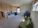 Bright bonus room featuring a modern modular sofa, play tent, and organized storage at 4810 Oak Hl Dr, Lebanon, IN 46052