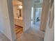 Hallway view showcases a modern bathroom and a charming bedroom area beyond at 4810 Oak Hl Dr, Lebanon, IN 46052