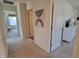 Bright hallway with neutral decor leads to various rooms, offering a glimpse of home's layout at 4810 Oak Hl Dr, Lebanon, IN 46052