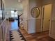 Inviting foyer featuring wood floors, neutral decor, and a view of the staircase and living area at 4810 Oak Hl Dr, Lebanon, IN 46052