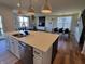 Open kitchen with a large island, stainless steel appliances, and modern pendant lighting at 4810 Oak Hl Dr, Lebanon, IN 46052