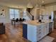 Stylish kitchen features an island with counter seating, stainless steel appliances, and pendant lighting at 4810 Oak Hl Dr, Lebanon, IN 46052