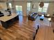 Spacious open floor plan featuring a kitchen, living room, and dining area with hardwood floors at 4810 Oak Hl Dr, Lebanon, IN 46052
