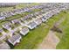Aerial view of a residential neighborhood, featuring homes with well-kept lawns and close proximity to a golf course at 4922 Birmingham Dr, Indianapolis, IN 46235